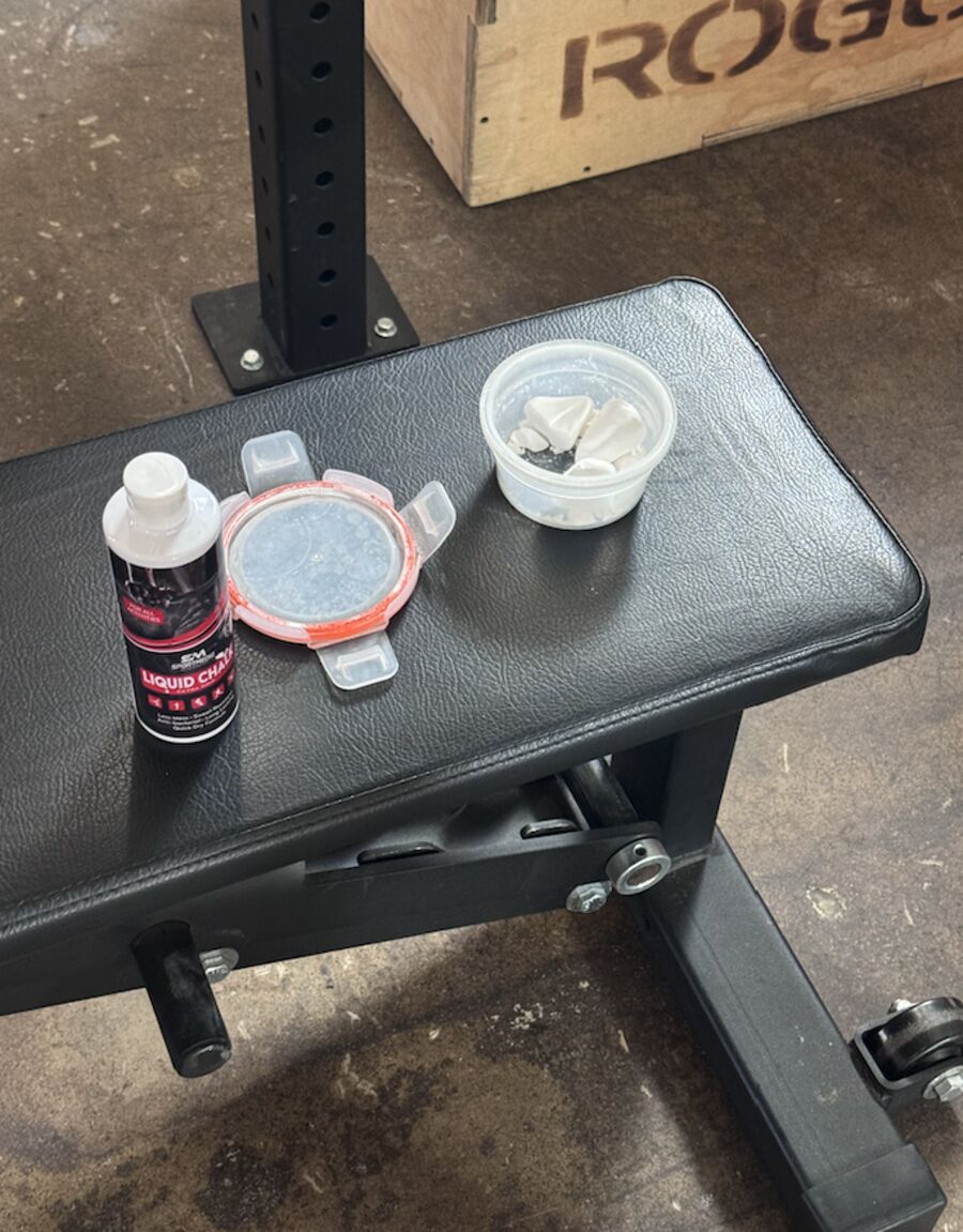 Liquid chalk bottle and spilled chalk